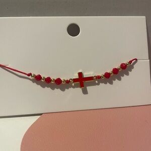 Cross Tie Bracelet in the color Ruby Red